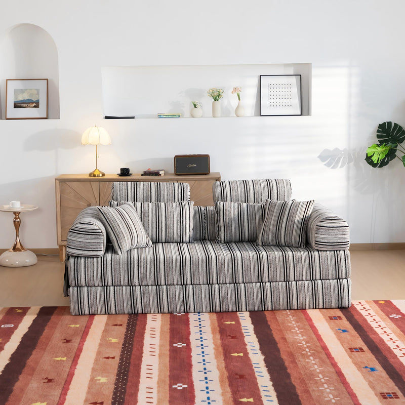 Sleeper sofa bed with striped fabric upholstery and padded armrests, front view