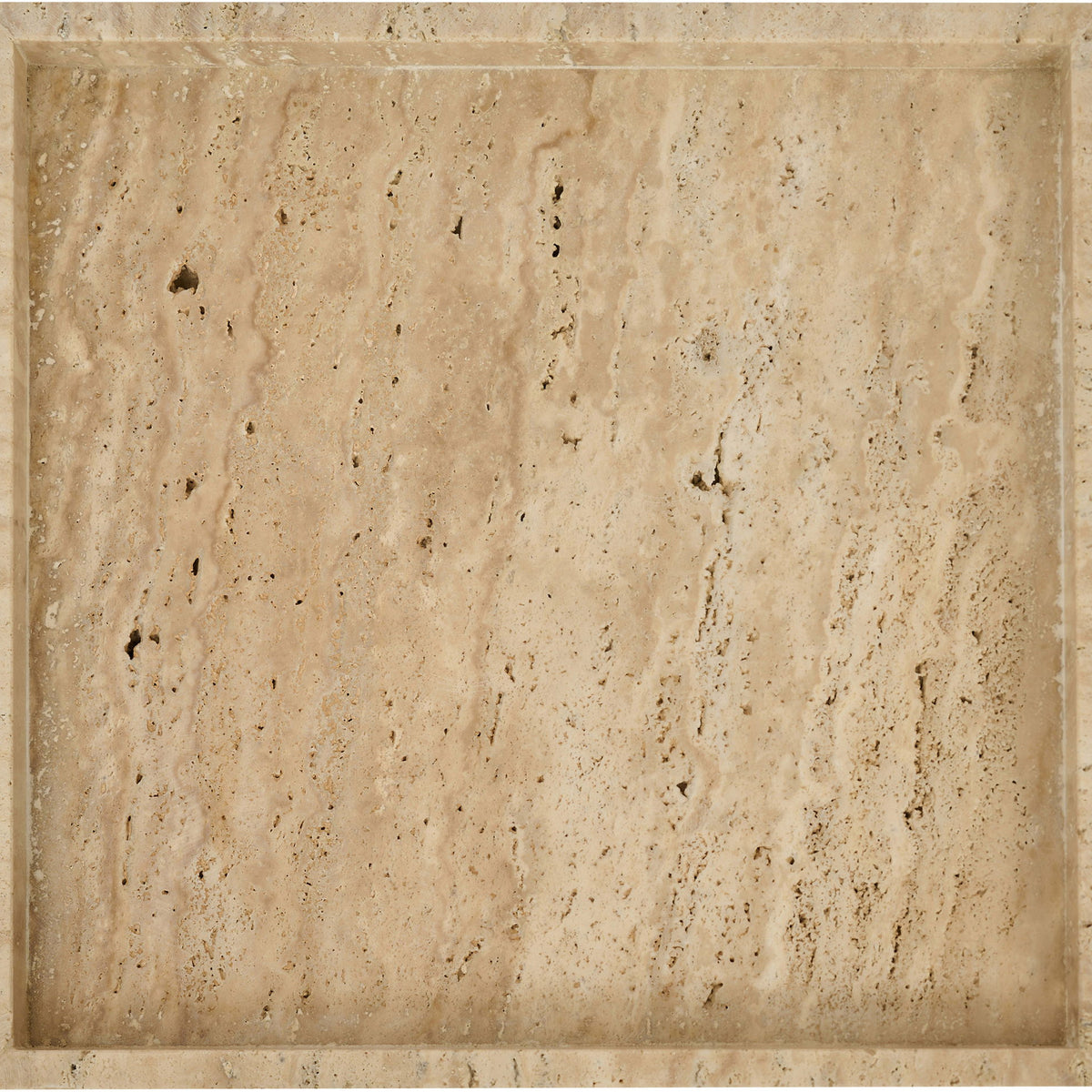 Beige travertine tray close-up of recessed square center with speckled stone texture