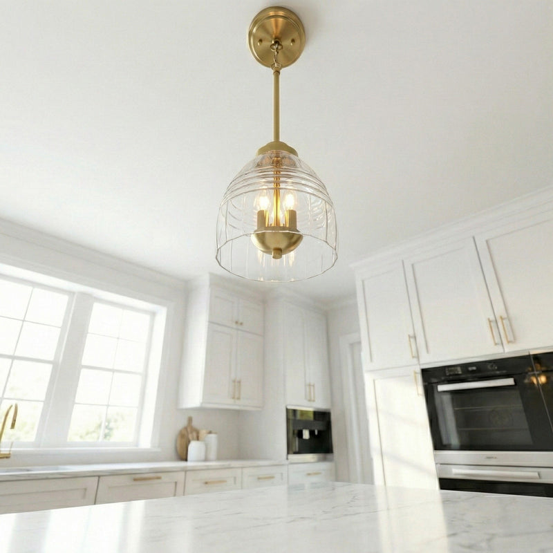 Gold ceiling-mount chain pendant with clear glass globe and three candle bulbs