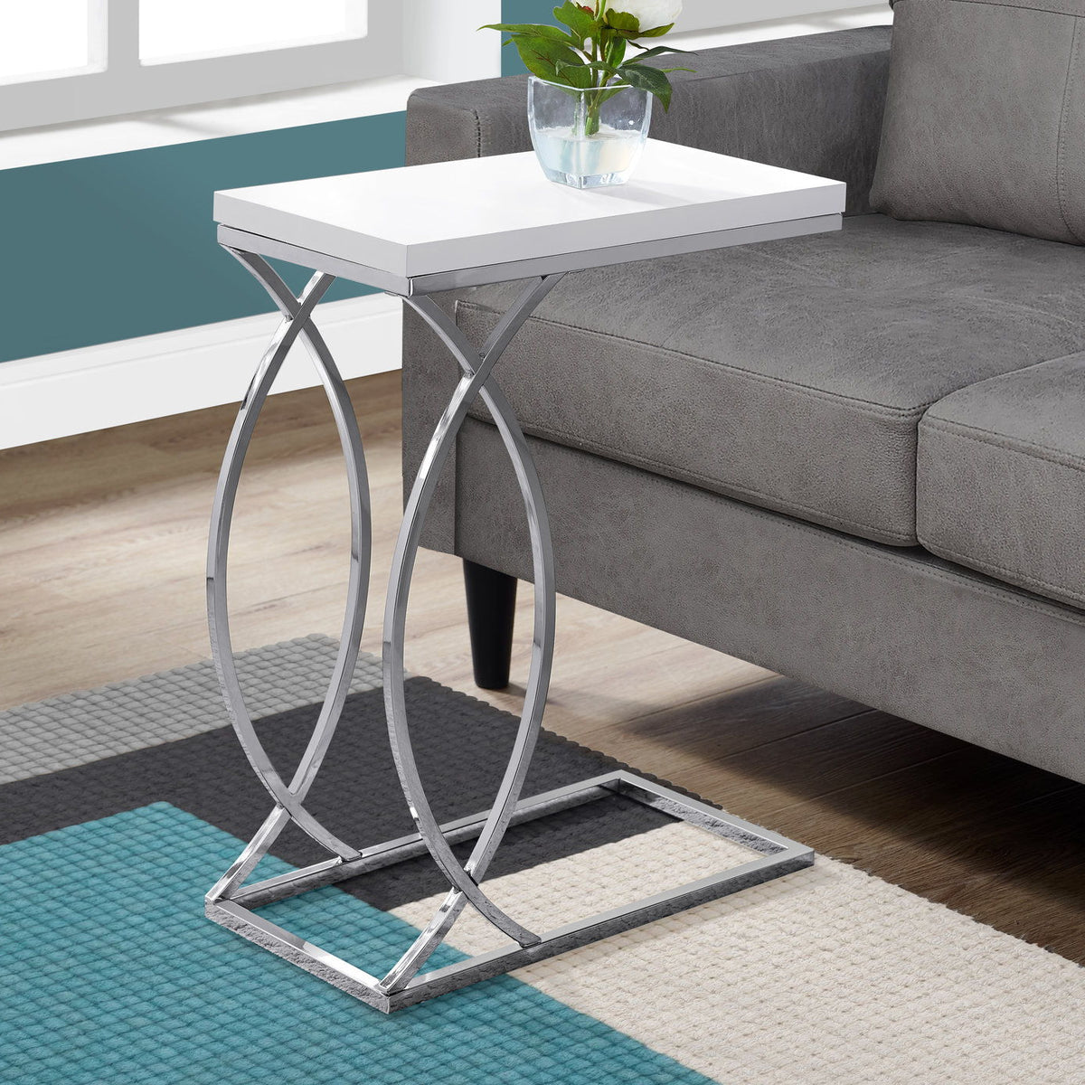 White C-shaped accent table with square top and chrome-style metal X base.