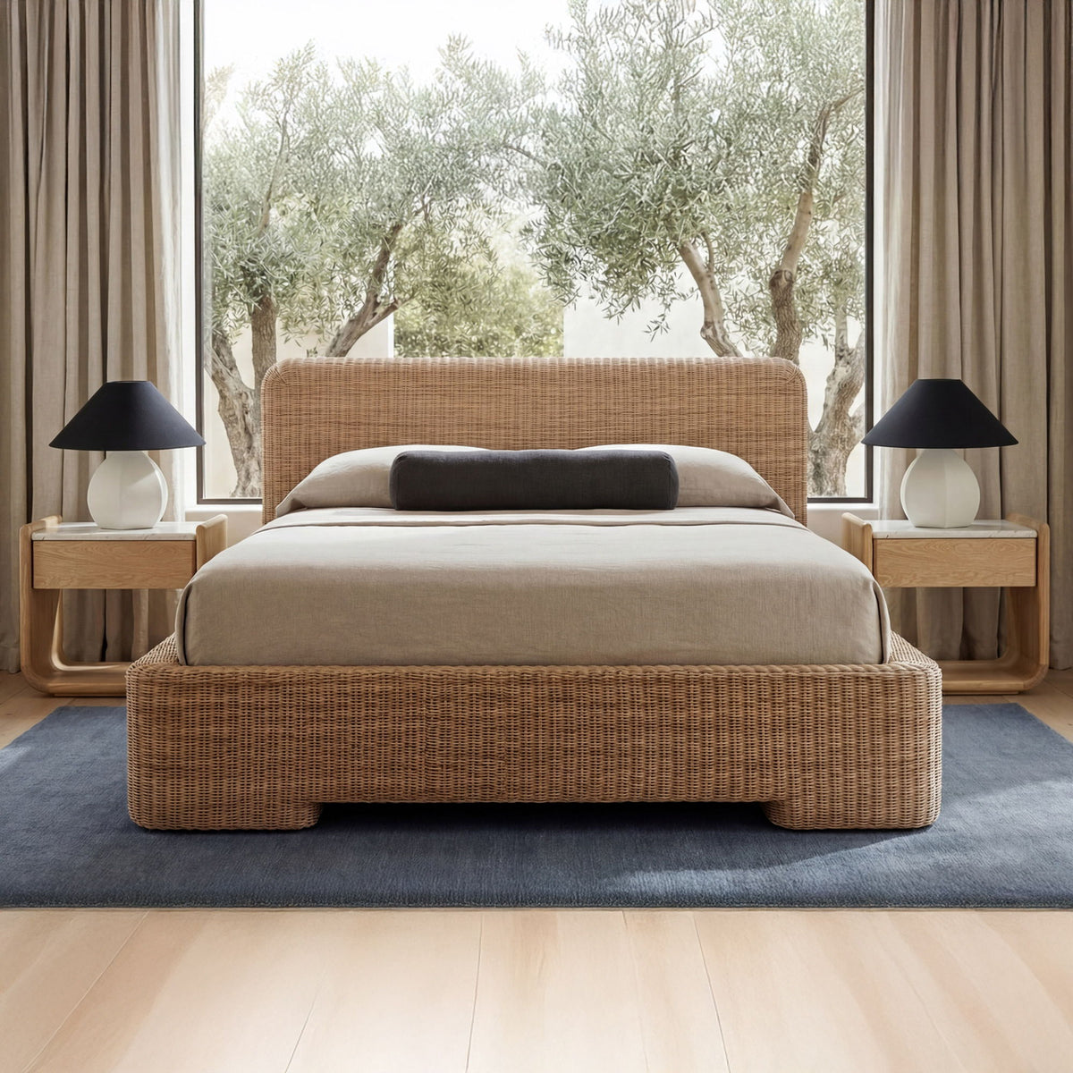 Natural wood bedside table with open shelf, shown beside a bed