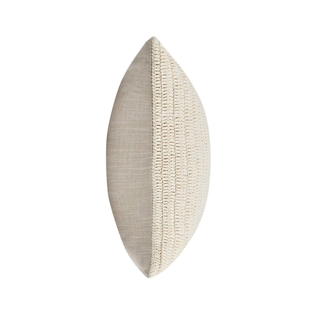 Two-sided knit throw pillow in light beige with visible seam and edge finish