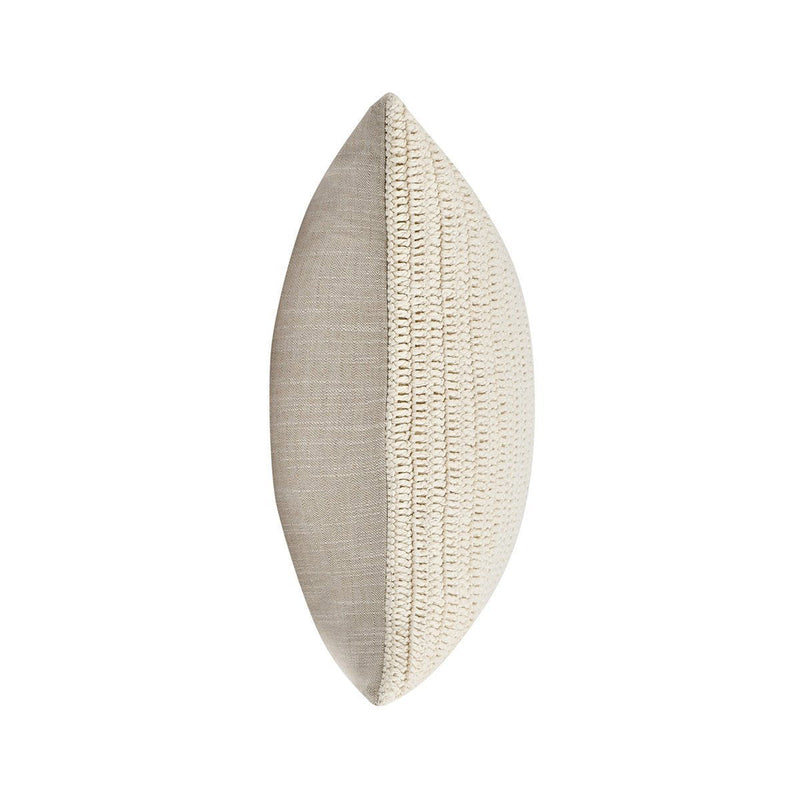 Two-sided knit throw pillow in light beige with visible seam and edge finish
