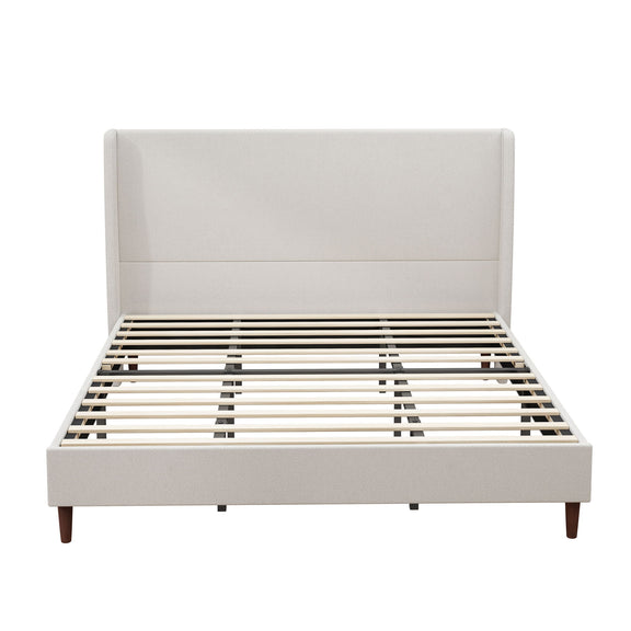 Upholstered bed with beige headboard, exposed slats, and wood legs