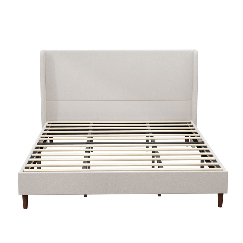 Upholstered bed with beige headboard, exposed slats, and wood legs