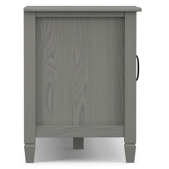 Gray TV stand side panel with tapered legs and recessed door panel
