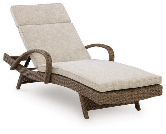 Beige chaise lounge with cushion and dark wicker frame, reclining backrest