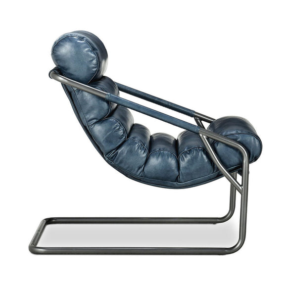 Jackson accent chair in blue leather with tufted back and curved sled base