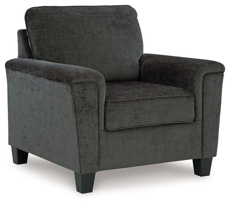 Upholstered armchair with dark gray textured fabric, padded arms and back