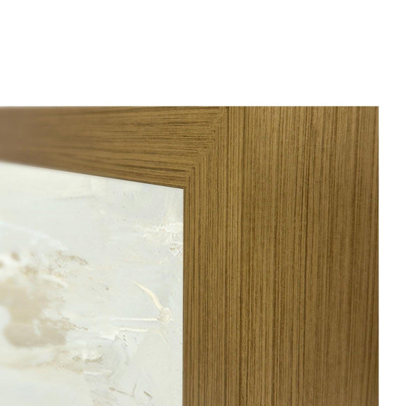 Gold-toned frame corner with woodgrain texture around abstract painting
