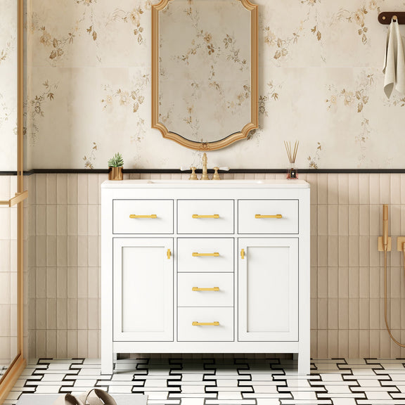 White bathroom vanity with sink, four drawers, two doors, and gold-tone pulls