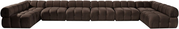 Dark brown modular sectional sofa with tufted, padded cushions and curved arm