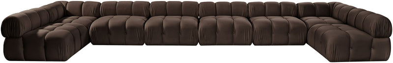 Dark brown modular sectional sofa with tufted, padded cushions and curved arm
