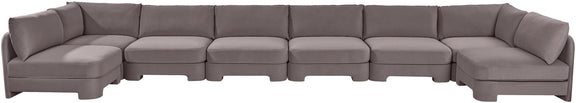 Dark gray velvet armless sectional sofa with low back and padded seat cushions