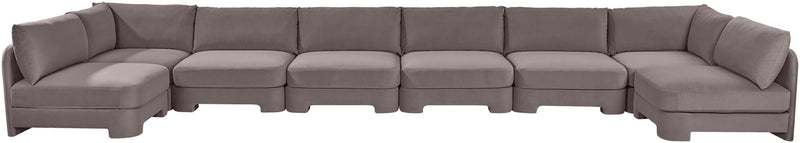 Dark gray velvet armless sectional sofa with low back and padded seat cushions