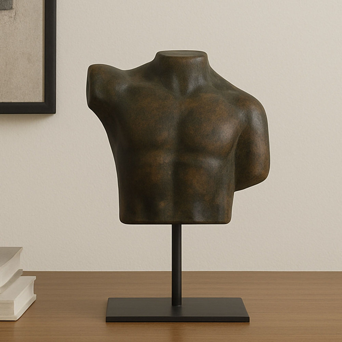 Cast aluminum torso sculpture with dark brown-green patina finish on black base.