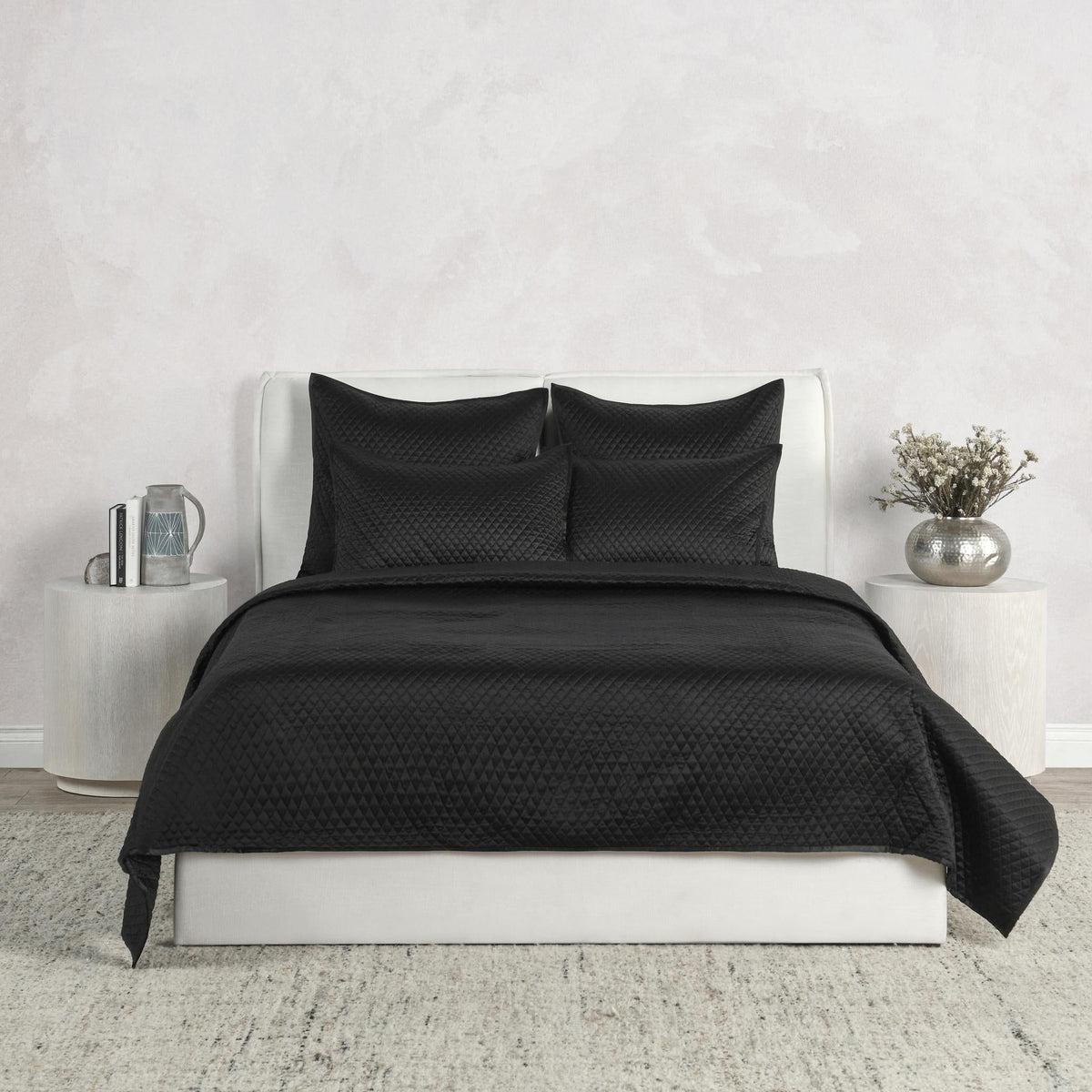 Black diamond-quilted pillow sham with subtle textured pattern