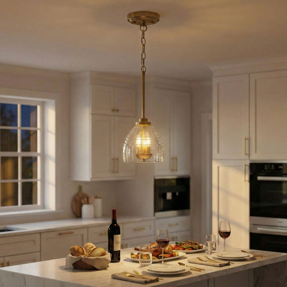 Gold chain pendant light with clear glass globe and three candle-style bulbs