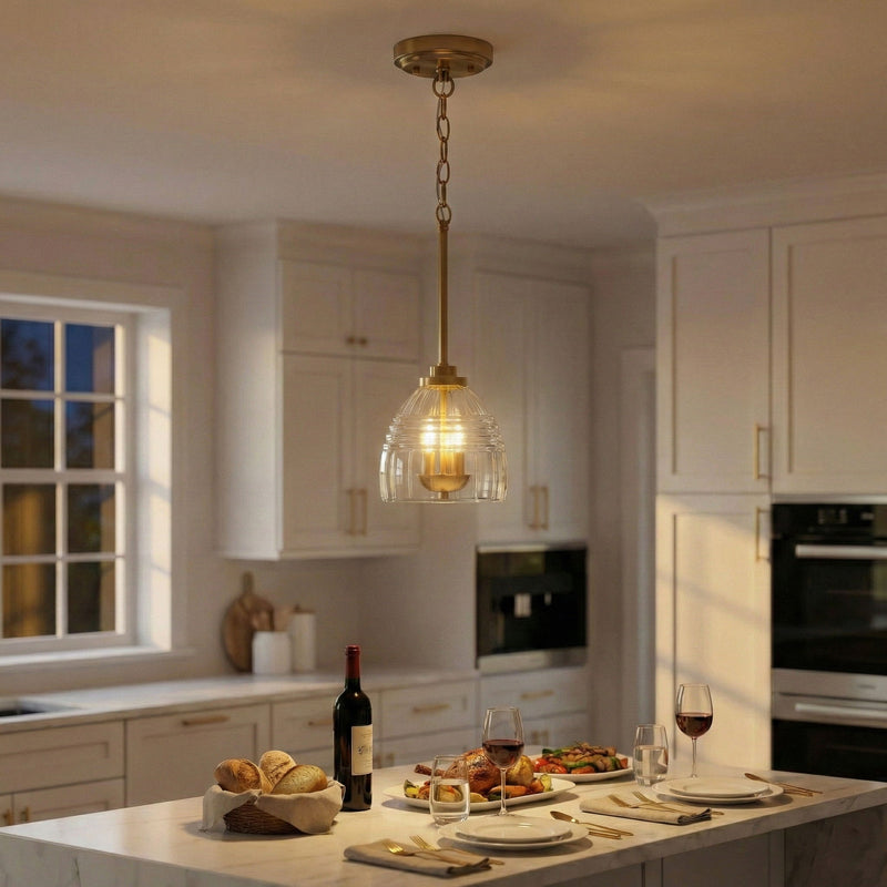 Gold chain pendant light with clear glass globe and three candle-style bulbs