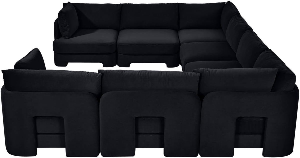 Black velvet performance sectional with deep seats and rounded arms in a U-shaped layout