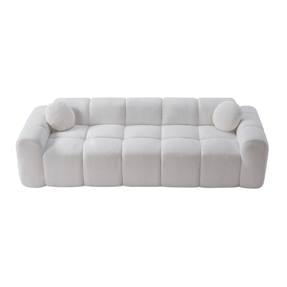 White cloud-puff compression sofa with padded back cushions and rounded armrests