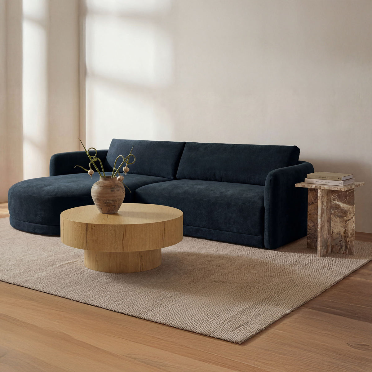 Round rustic oak coffee table with pedestal base on a living room rug