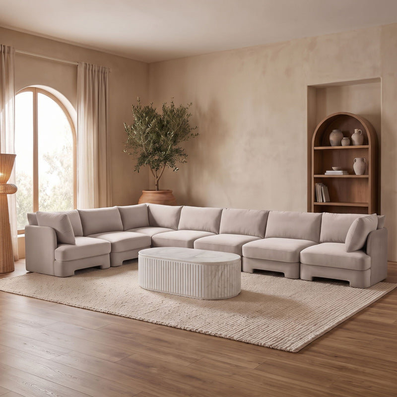 Light gray upholstered 7-piece sectional sofa with chaise and corner seats
