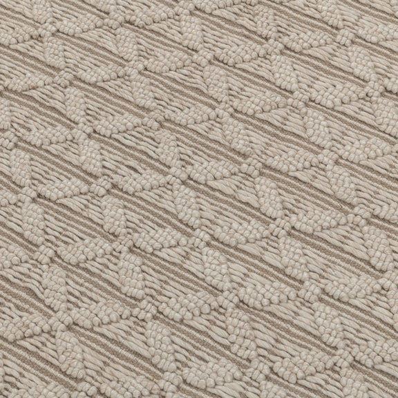 Beige textured rug surface with raised looped pattern and geometric stripes.