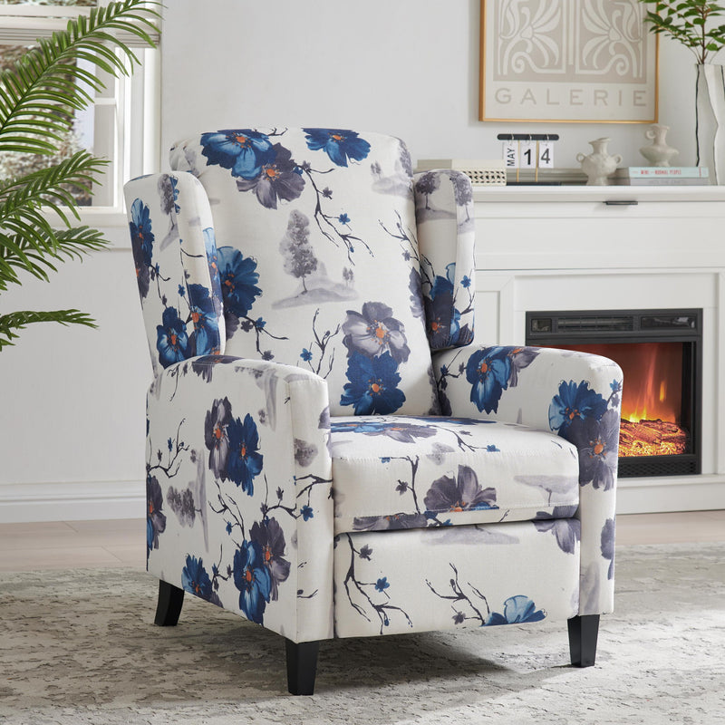 Wingback recliner chair with blue floral upholstery, padded armrests and cushioned seat