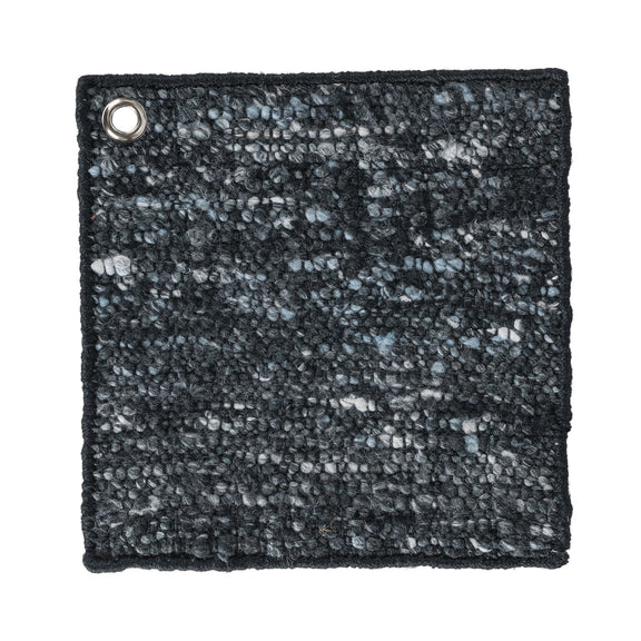 Dark charcoal area rug with light speckled pattern and metal grommet corner