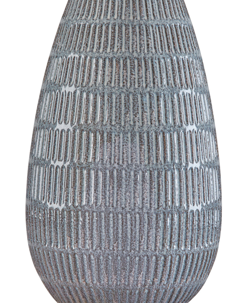Blue-gray ceramic table lamp base close-up with ribbed, dotted texture