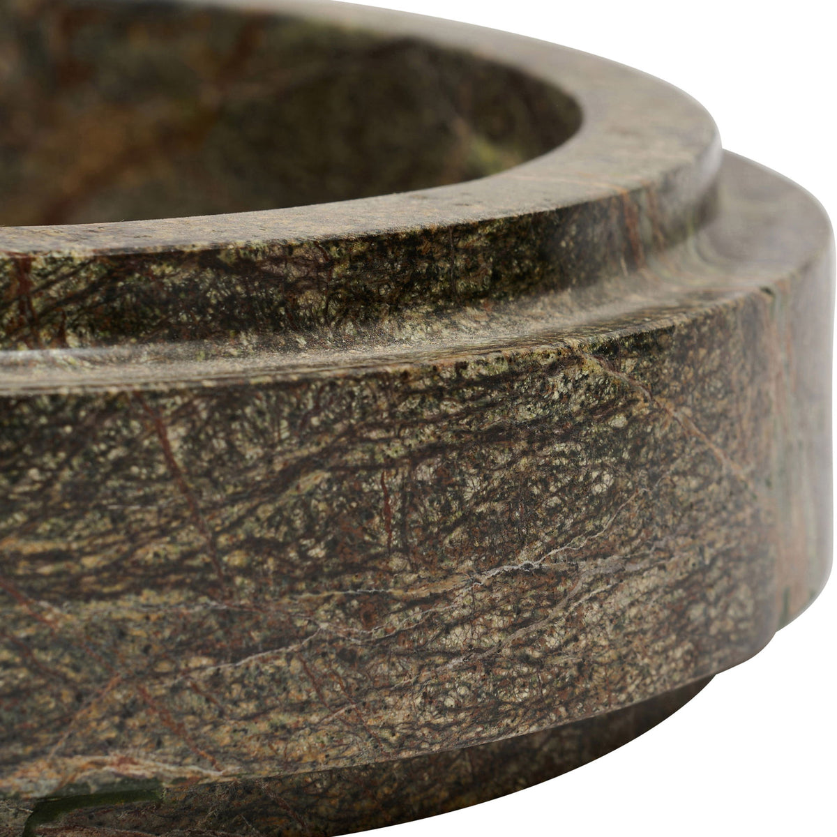 Green marble bowl side detail with rounded rim and natural veining.