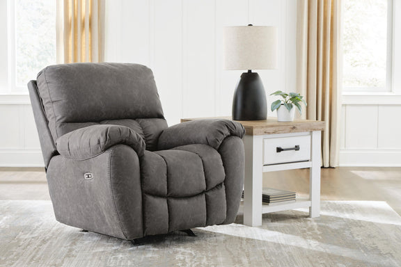 Power rocker recliner with adjustable headrest, dark gray fabric, plush back and padded armrests
