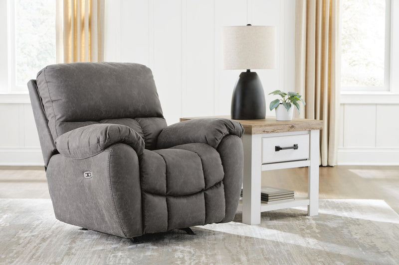 Power rocker recliner with adjustable headrest, dark gray fabric, plush back and padded armrests