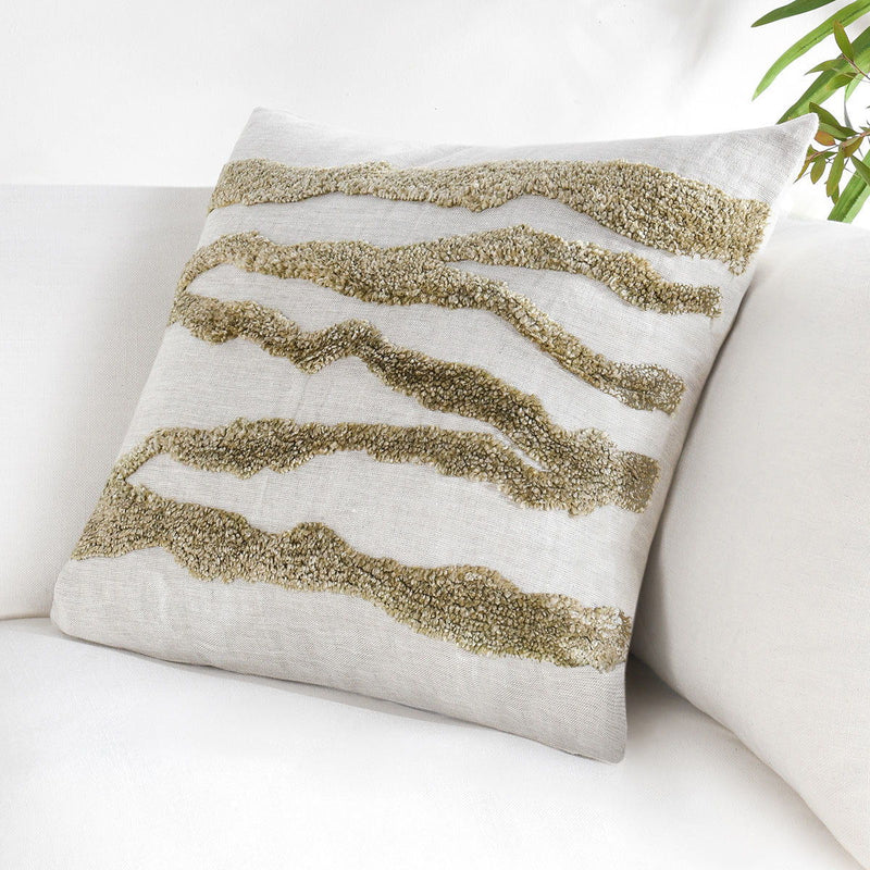 Light gray decorative pillow with olive textured wavy stripe panel, side view
