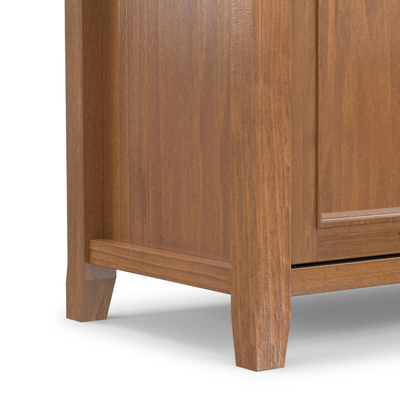 Saddle brown TV media stand corner with angled legs and drawer front