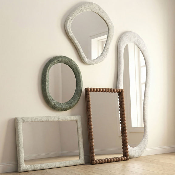 Natural wood rectangular wall mirror with rounded beaded carved frame, shown leaning upright.