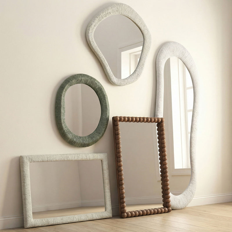 Natural wood rectangular wall mirror with rounded beaded carved frame, shown leaning upright.
