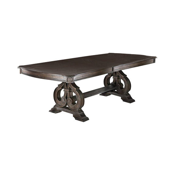 Rustic rectangular dining table with dark brown top and ornate pedestal legs
