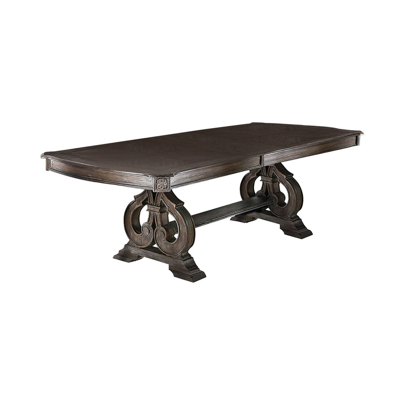 Rustic rectangular dining table with dark brown top and ornate pedestal legs