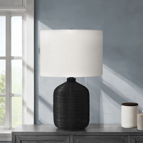 Modern table lamp with black rattan base and white fabric drum shade
