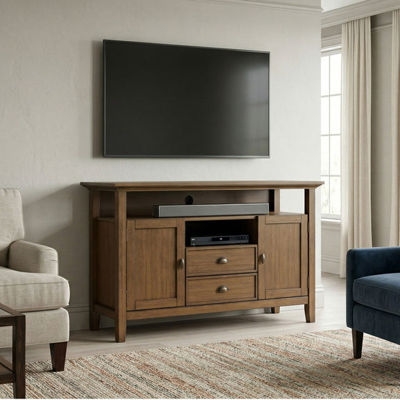 Tall rustic media stand in aged brown wood with cabinet doors and drawer storage