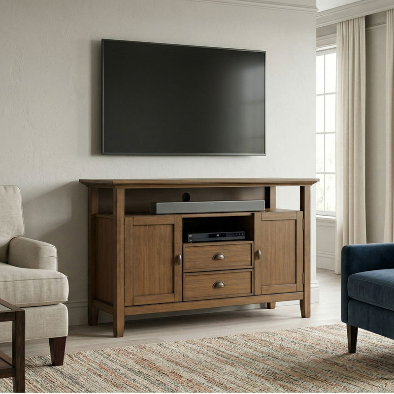 Tall rustic media stand in aged brown wood with cabinet doors and drawer storage