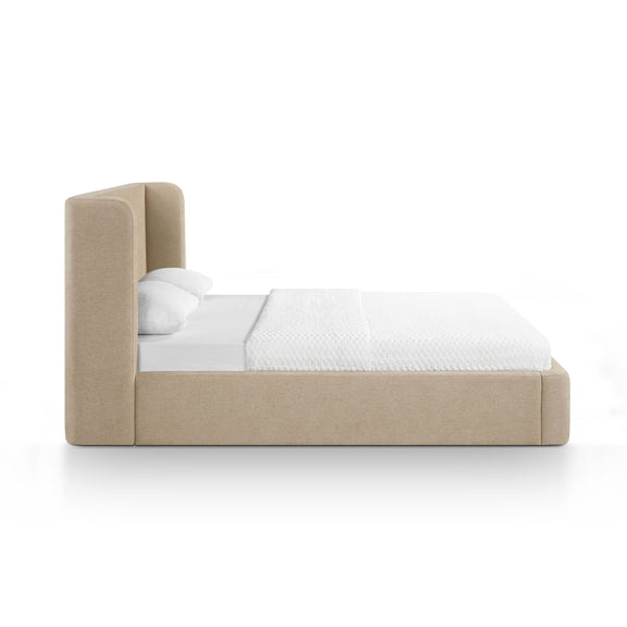 Upholstered platform bed with tall headboard, beige fabric frame and white pillows