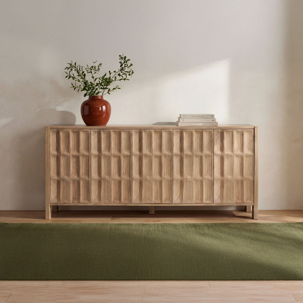 Natural wood sideboard with six paneled doors and a styled top surface