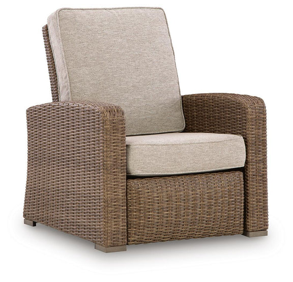 Beige fabric recliner chair with woven wicker sides and padded seat cushion