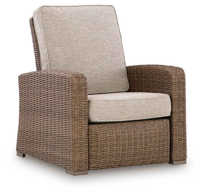 Beige fabric recliner chair with woven wicker sides and padded seat cushion