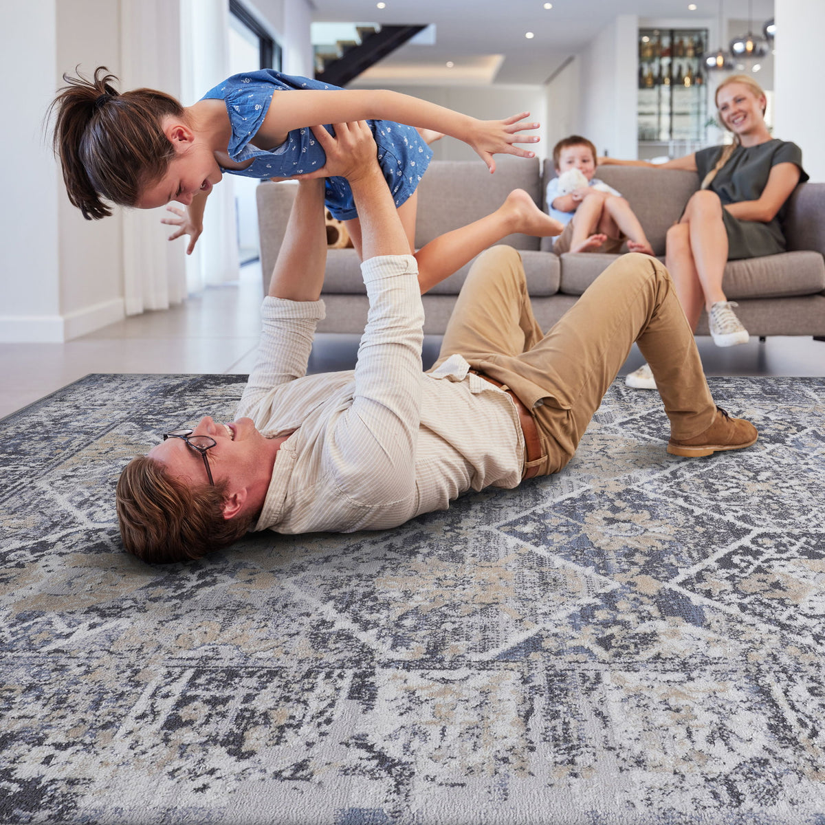 Gray and blue traditional area rug with distressed geometric pattern, square area format