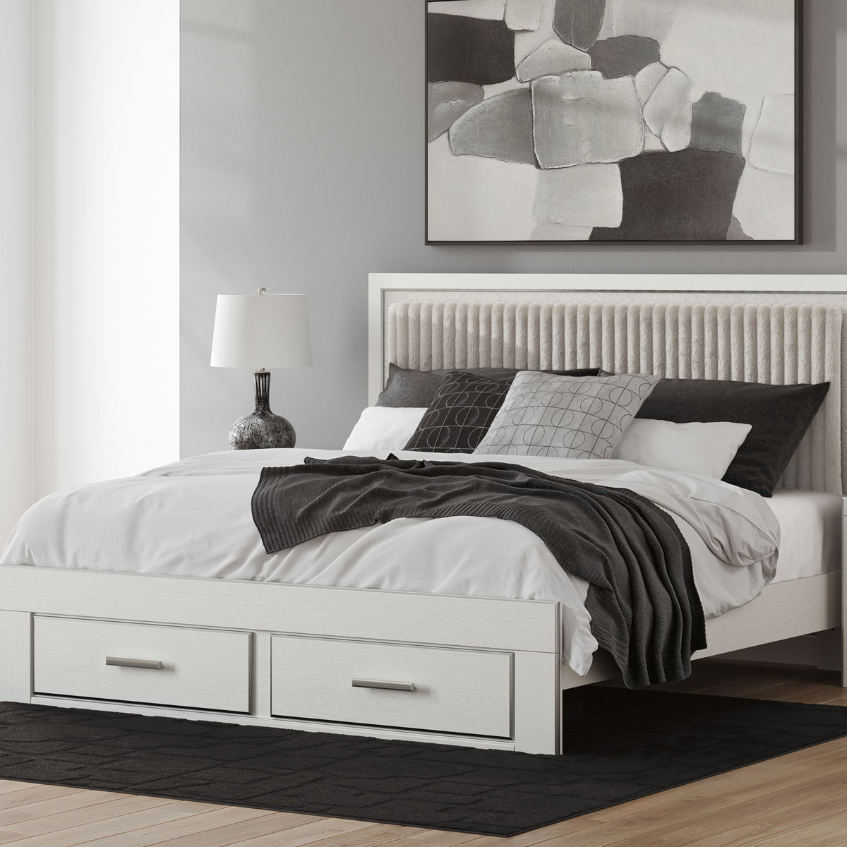 White upholstered panel storage bed with slatted base and two front drawers