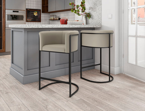 Set of two light beige upholstered counter stools with curved black base frames